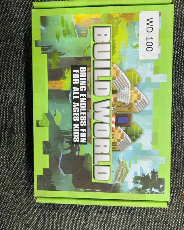The same green box square to the camera, the pixel landscape and the WD-100 label both readable.